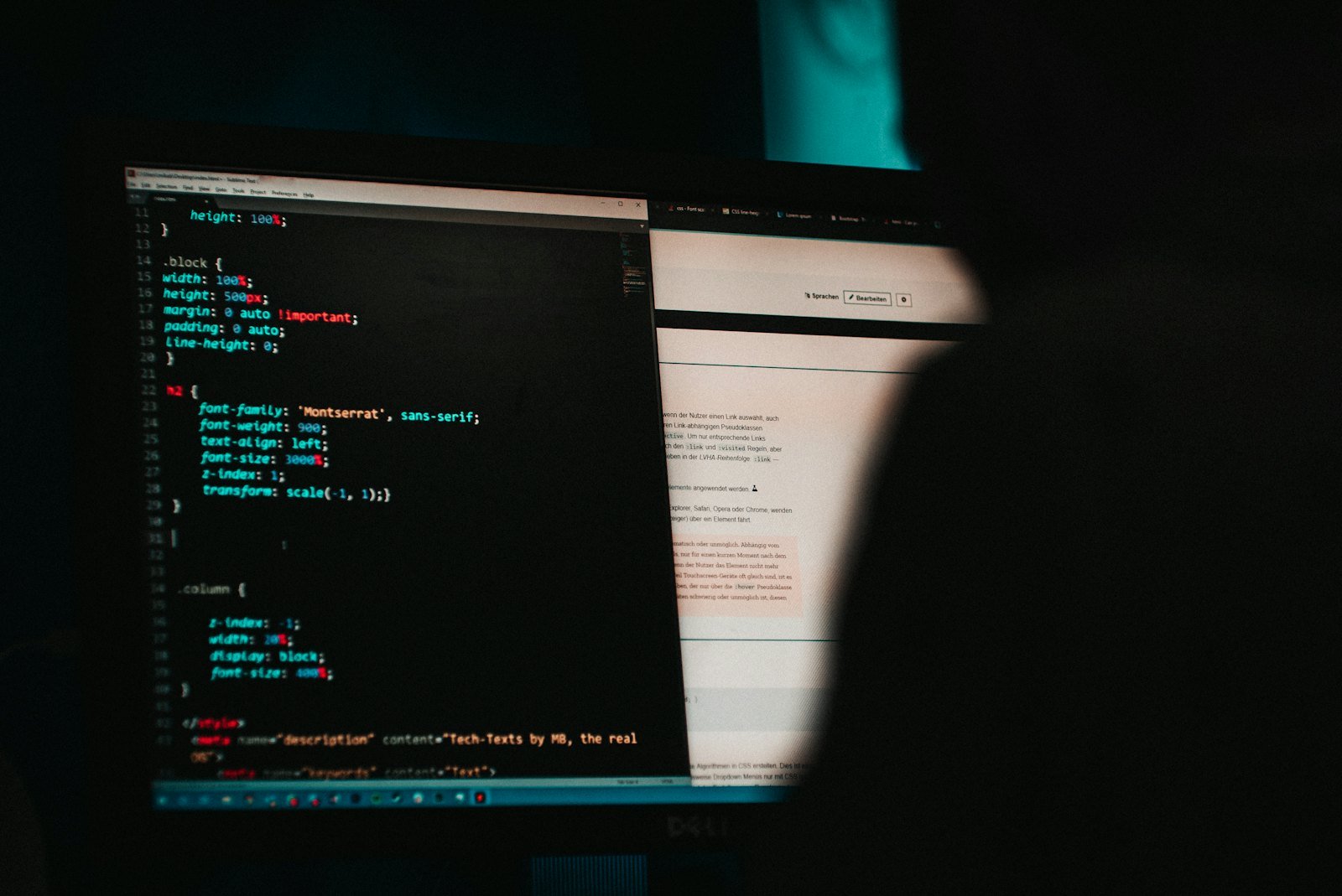 Person at a laptop with code on screen